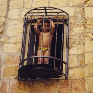small child in cage