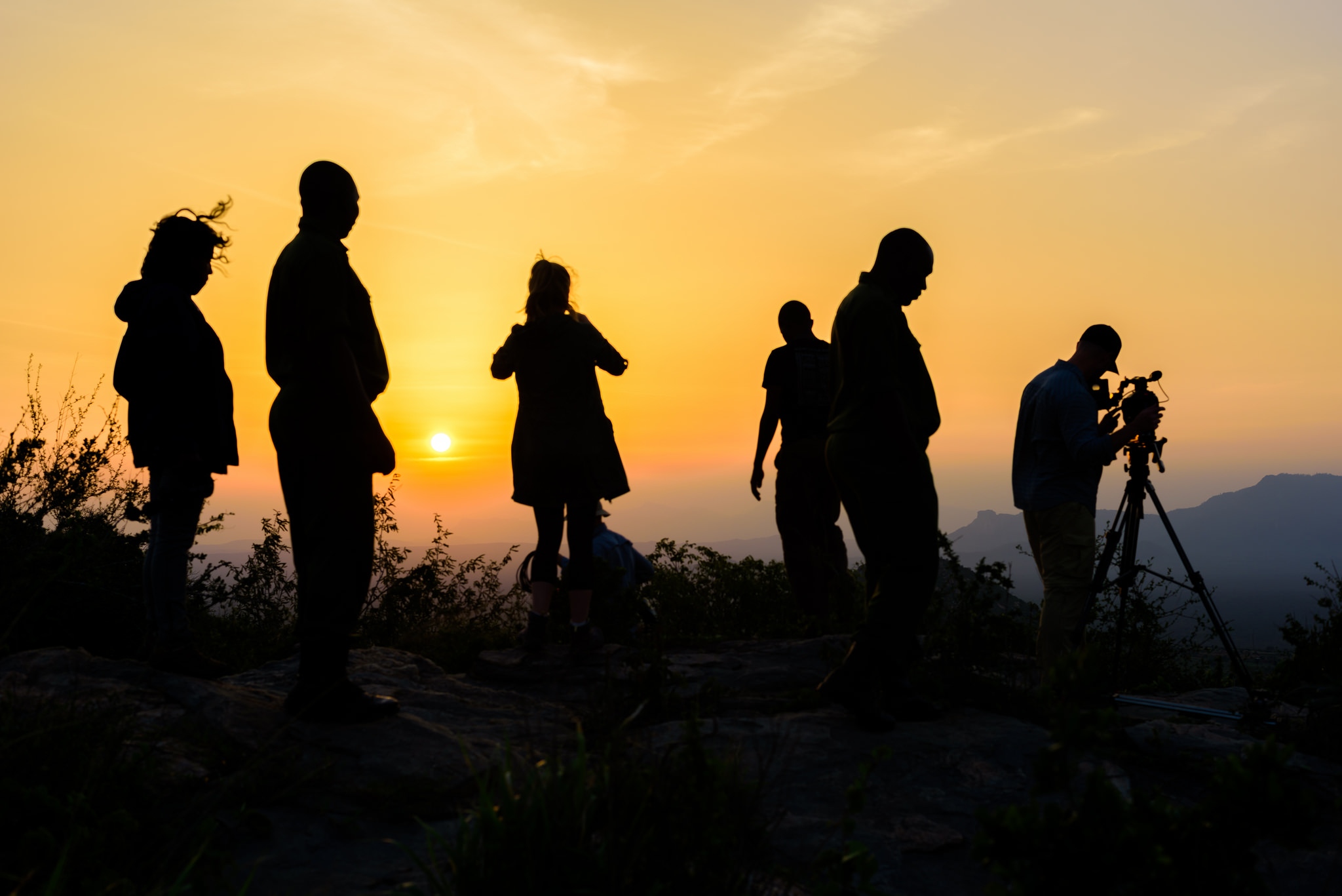people silhouettes in sunrise