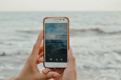 image of iphone taking a picture of the sea