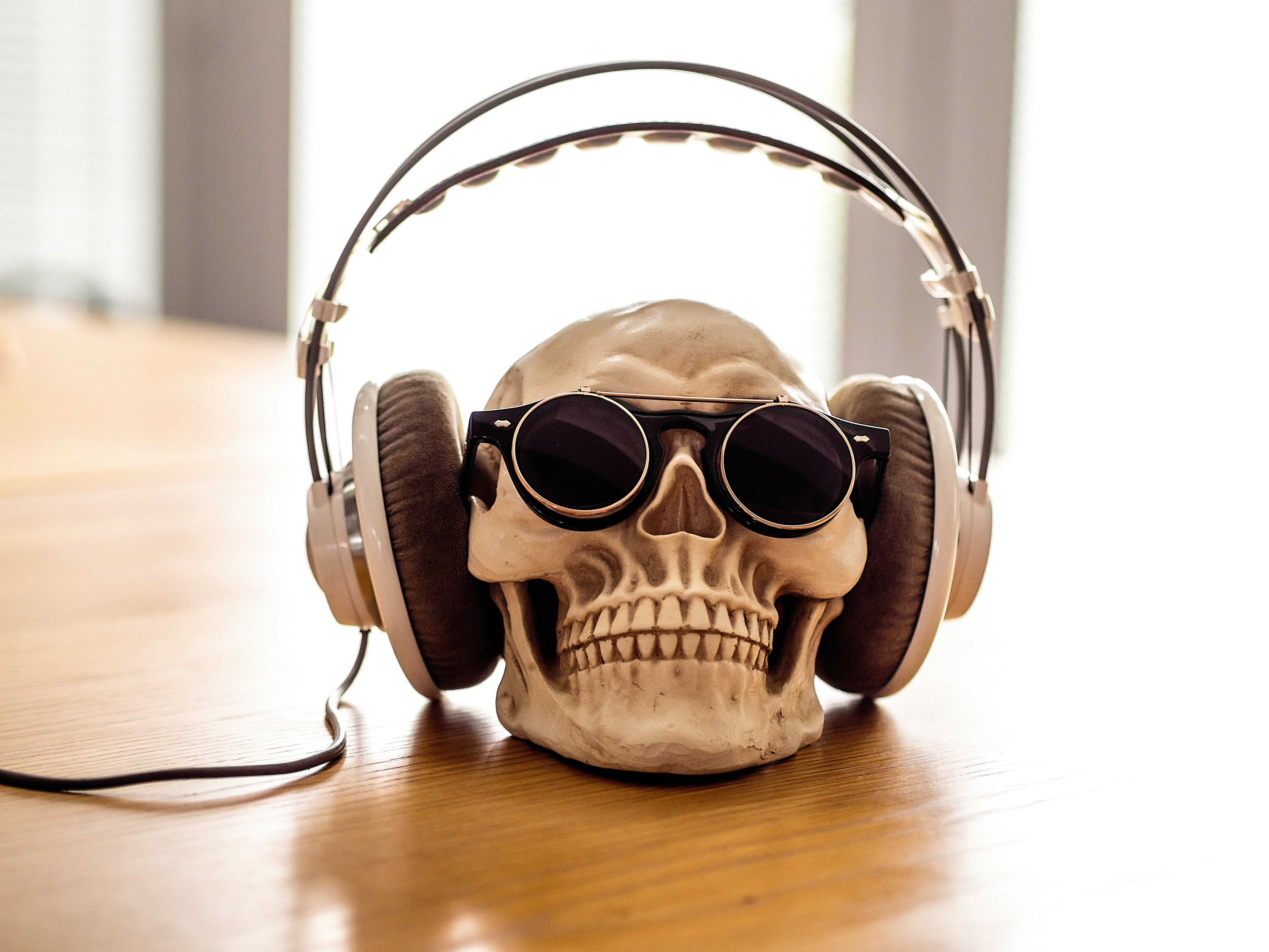 A skull wearing white headphones
